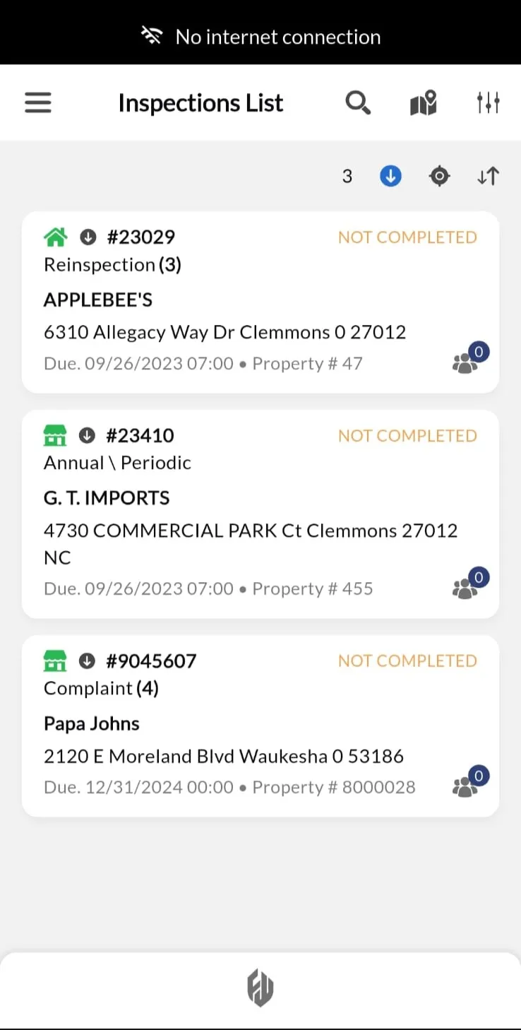 Offline mode indicator showing 'Working Offline' banner at top of inspection screen. Property details fully accessible with all form fields editable. Download status shows '3 inspections downloaded' with sync pending icon. All functionality available without network connection.